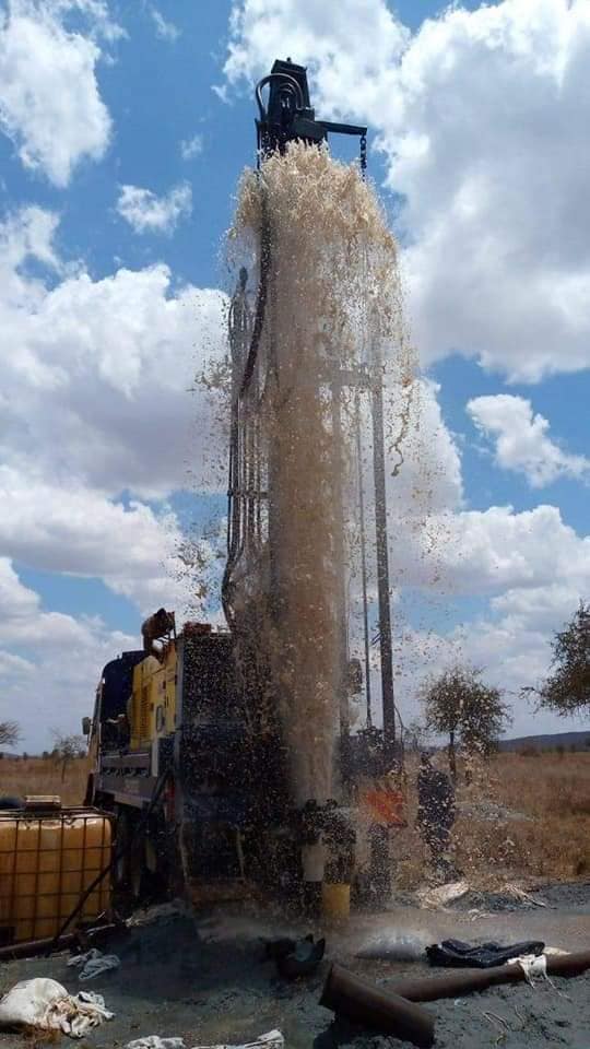 AquaEco Water Solutions borehole drilling rig at work. AquaEco borehole financing process.  