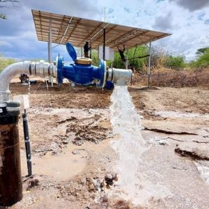 AquaEco Water Solutions team installing solar panels to power a borehole solar pump for domestic use