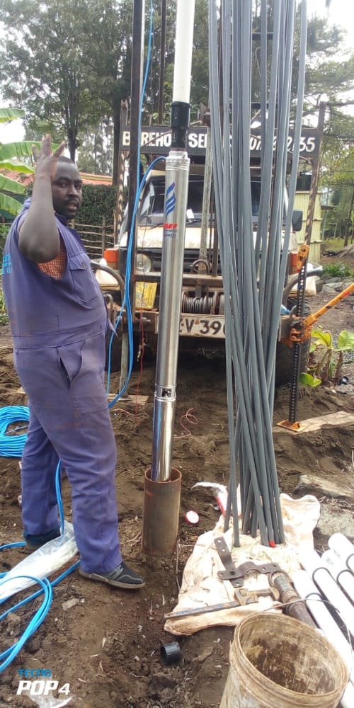 AquaEco Water Solutions installation team installing a pump  