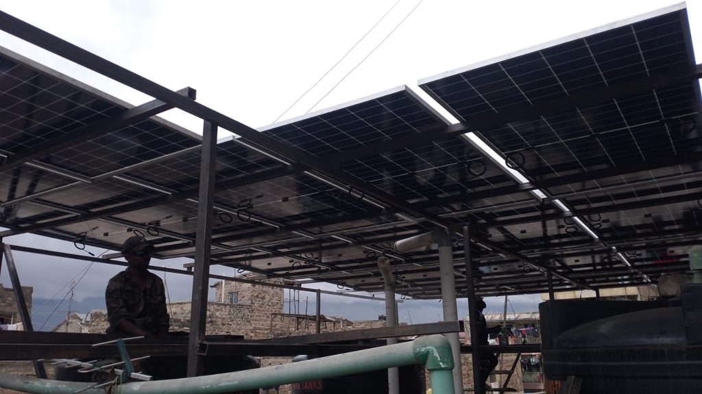 AquaEco Water Solutions technical team installing a solar system at Kariobangi, Nairobi